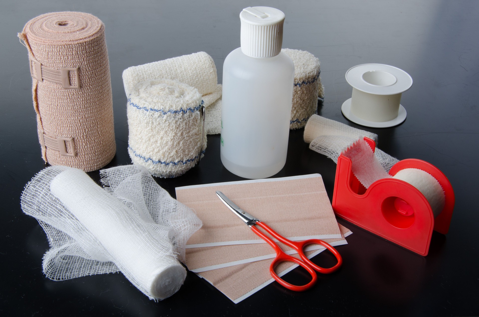 Different rolls of medical bandages and care equipment